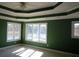 Well lit bedroom with lake views, unique ceiling design, neutral walls, and carpeted floor at 2697 Bethel Ne Rd, Conyers, GA 30012