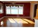 Sunlit dining room with hardwood floors and lake views at 2697 Bethel Ne Rd, Conyers, GA 30012