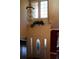 Grand two-story foyer with chandelier, transom windows, and decorative front door at 2697 Bethel Ne Rd, Conyers, GA 30012