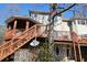 Back exterior of house featuring multi-level deck and lattice privacy panels at 2697 Bethel Ne Rd, Conyers, GA 30012