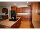 Gourmet kitchen features an island cooktop, hardwood floors and wooden cabinets at 2697 Bethel Ne Rd, Conyers, GA 30012