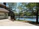 House exterior showcasing a deck and a serene lake view at 2697 Bethel Ne Rd, Conyers, GA 30012