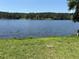 Scenic lake view surrounded by lush greenery and mature trees, offering a tranquil and picturesque setting at 2697 Bethel Ne Rd, Conyers, GA 30012