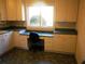 Bright laundry room featuring built-in cabinets, counter space, and a convenient work area at 2697 Bethel Ne Rd, Conyers, GA 30012