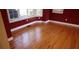 Spacious living room with hardwood floors and red walls at 2697 Bethel Ne Rd, Conyers, GA 30012