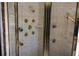 Custom shower featuring multiple shower heads and sprays with glass door enclosure at 2697 Bethel Ne Rd, Conyers, GA 30012