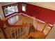 View from the top of wooden staircase down into the house's living area at 2697 Bethel Ne Rd, Conyers, GA 30012