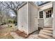 Home's backyard is accessible via a side door and concrete steps at 332 Shadowmoor Dr, Decatur, GA 30030