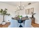 Stylish dining room features modern light fixture, round table and seating for four at 332 Shadowmoor Dr, Decatur, GA 30030