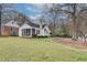 Charming white home with a screened porch and well-maintained lawn and landscaping at 332 Shadowmoor Dr, Decatur, GA 30030