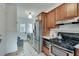 Functional kitchen with stainless steel appliances and adjacent laundry area at 332 Shadowmoor Dr, Decatur, GA 30030