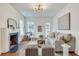 Cozy living room featuring a fireplace, hardwood floors, and plenty of natural light creating a welcoming space at 332 Shadowmoor Dr, Decatur, GA 30030