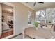 Relaxing screened porch offers a view into the living room with dining and lounge seating at 332 Shadowmoor Dr, Decatur, GA 30030