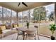 Inviting screened porch with comfortable seating, a ceiling fan, and serene views of the surrounding landscape at 332 Shadowmoor Dr, Decatur, GA 30030