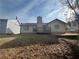 House exterior showcasing a deck and sloped backyard at 754 Shore Dr, Lithonia, GA 30058