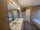 Bathroom boasts double vanity and a large garden tub at 754 Shore Dr, Lithonia, GA 30058