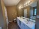 Bathroom with double vanity, garden tub, and separate shower at 754 Shore Dr, Lithonia, GA 30058