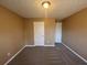 Spacious bedroom featuring carpet, dual closets, and neutral wall colors at 754 Shore Dr, Lithonia, GA 30058