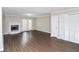 Bright living room featuring fireplace and wood-look floors at 896 Glynn Oaks Dr, Clarkston, GA 30021