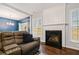 Living room fireplace with a white mantel and dark hearth at 1693 Fair Oak Way, Mableton, GA 30126