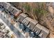 Birds eye view of neighboring homes, street, sidewalks, driveways, and mature trees at 1693 Fair Oak Way, Mableton, GA 30126