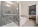 Contemporary bathroom showcasing a glass-enclosed shower and a soaking tub at 1693 Fair Oak Way, Mableton, GA 30126