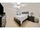 Bedroom with a ceiling fan, carpet, and dark wood furniture at 1693 Fair Oak Way, Mableton, GA 30126