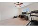 Bedroom with natural light, featuring a desk, workout equipment, and ceiling fan at 1693 Fair Oak Way, Mableton, GA 30126