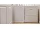 Laundry room featuring a white, front-loading washer and dryer set at 1693 Fair Oak Way, Mableton, GA 30126