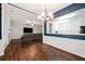 Open-concept living space with a fireplace, comfortable seating, and seamless flow into the dining area at 1693 Fair Oak Way, Mableton, GA 30126