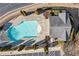 Aerial view of a community pool, pool house, manicured shrubs, and parking at 1693 Fair Oak Way, Mableton, GA 30126