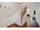 Elegant staircase with wood railing and carpeted steps, leading to the upper level at 1693 Fair Oak Way, Mableton, GA 30126