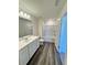 Bathroom with white vanity, bathtub, and gray floor at 178 Rydal Way, Winder, GA 30268