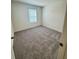 Bright bedroom with gray carpet and window coverings at 178 Rydal Way, Winder, GA 30268