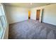 Spacious bedroom with gray carpet and large window at 178 Rydal Way, Winder, GA 30268