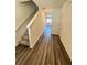 Bright entryway with hardwood floors and staircase at 178 Rydal Way, Winder, GA 30268