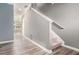 Modern staircase with grey walls and light grey vinyl plank flooring at 178 Rydal Way, Winder, GA 30268