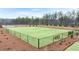 Fenced-in community dog park with green grass, benches, and waste receptacles at 297 Sound Cir, Stockbridge, GA 30281