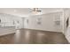 Spacious living room with hardwood floors and ceiling fan at 297 Sound Cir, Stockbridge, GA 30281