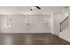 Large living room with hardwood floors and stairs at 297 Sound Cir, Stockbridge, GA 30281