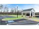 Community mailboxes with adjacent parking featuring accessible parking space and manicured green space at 297 Sound Cir, Stockbridge, GA 30281