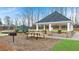 Community pavilion features picnic table, BBQ, and stone support columns at 297 Sound Cir, Stockbridge, GA 30281