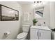 Clean and updated bathroom with white vanity and fixtures at 54 Ivy Ne Pkwy, Atlanta, GA 30342