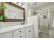 Elegant bathroom with white vanity, large mirror and shower at 54 Ivy Ne Pkwy, Atlanta, GA 30342