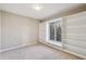 Spacious bedroom with built-in shelves and window views at 54 Ivy Ne Pkwy, Atlanta, GA 30342