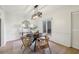 Charming dining room features a round table, four chairs, and a modern chandelier at 54 Ivy Ne Pkwy, Atlanta, GA 30342