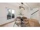 Bright dining area with a round wooden table and four matching chairs at 54 Ivy Ne Pkwy, Atlanta, GA 30342