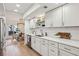 Modern kitchen features white cabinets, quartz countertops, and stainless steel appliances at 54 Ivy Ne Pkwy, Atlanta, GA 30342