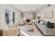 Bright living room features a stone fireplace, built-in shelving, and French doors leading to a patio at 54 Ivy Ne Pkwy, Atlanta, GA 30342