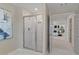 Modern bathroom with a walk-in shower and marble tile at 2416 Cadenza Cir, Dacula, GA 30019